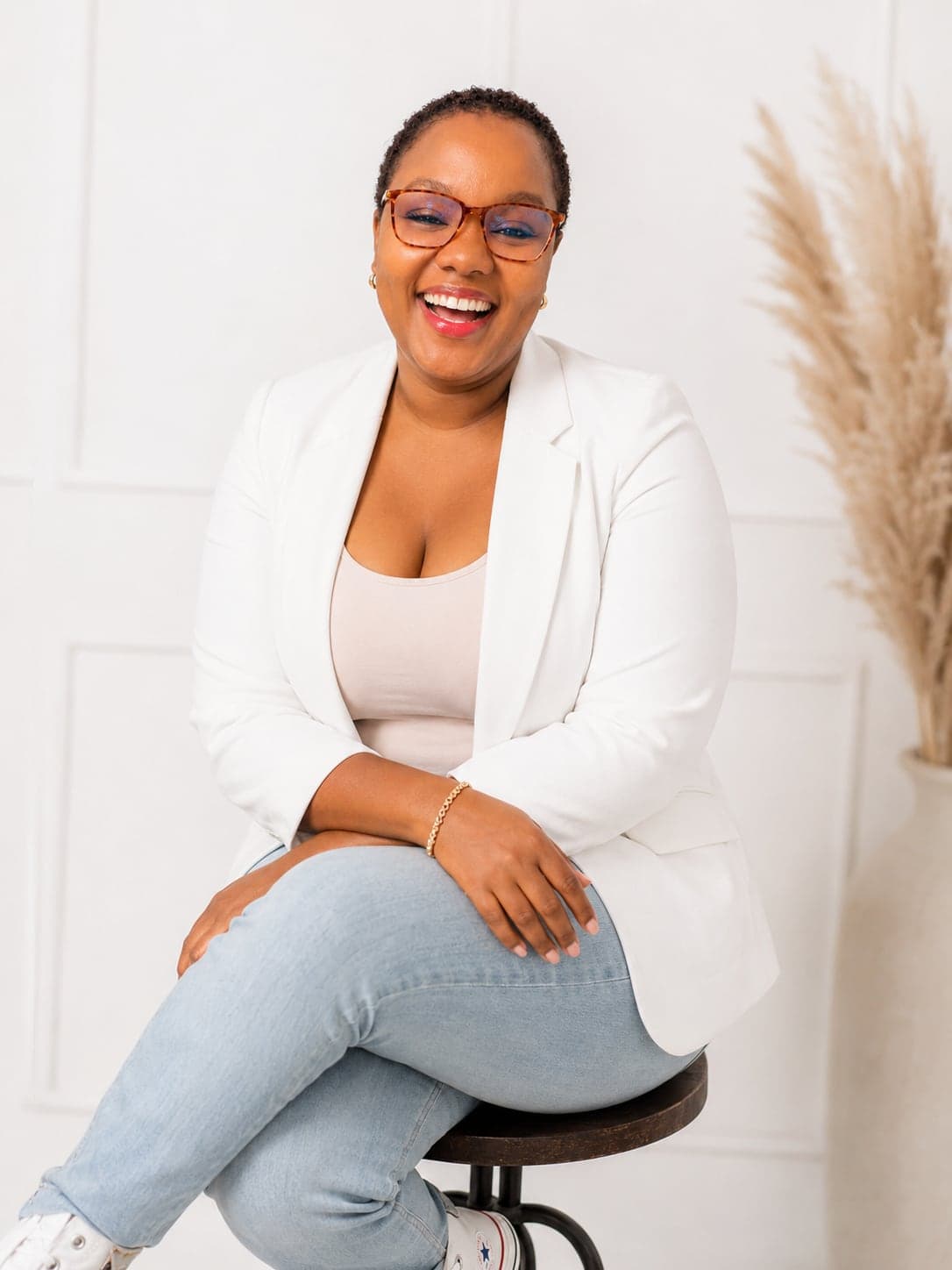 Portrait of Coach Kagiso smiling in a bright studio setting